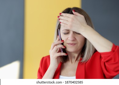 Woman Is Talking On Phone And Holding Her Forehead With Her Hand. Memory Impairment Forgetfulness Concept