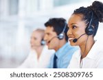 Woman, talking and smile in call center for customer support, telemarketing and FAQ in office. Female agent, contact or headset at help desk with team, communication or bilingual consultant with tech