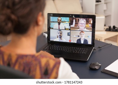 Woman talking with work colleagues on video call using tablet computer from home. - Shutterstock ID 1781147243