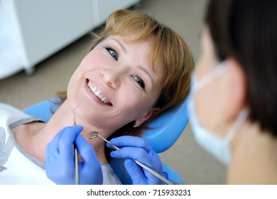 Woman Talks To Dentist With Smile