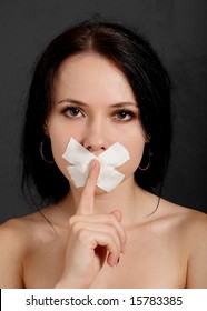 Woman With Tape Over Her Mouth.