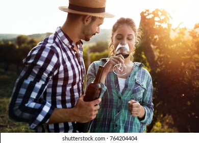 Woman Tasting Wine In Wine Grower Vineyard