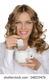 Woman With Tea Bag And Cup In Hand Isolated On White