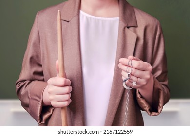 Woman Teacher Holding Muslim Crescent Moon Religious Symbol On School Blackboard In The Classroom