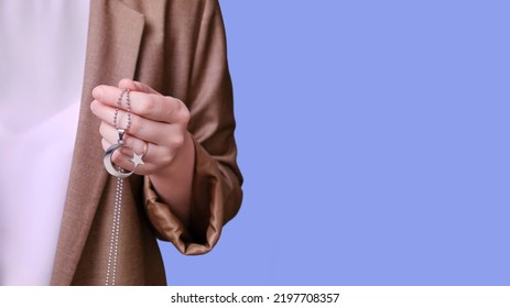 Woman Teacher Holding Muslim Crescent Moon Religious Symbol On Studio Blue Background, Banner Close-up