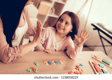 Woman Teaches Girl. Educational Games. Learning Child at Home. Child Development. Board Games for Children. Modern Learning for Children. Girl Learning Count. Learn Alphabet. Toy Colored Numbers.