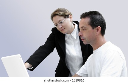Woman Teaching Computing To A Learning Adult.