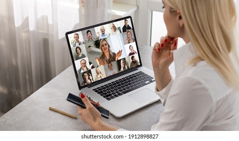 woman and team on laptop screen talking and discussion in video conference. Working from home, Working remotely, Self-isolation. - Shutterstock ID 1912898827