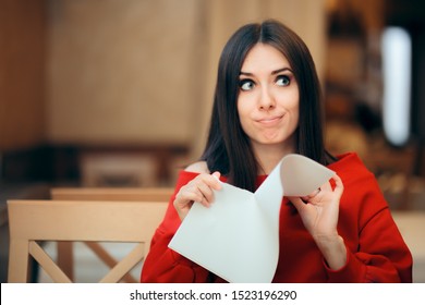 Woman Tearing Up Documents in a Restaurant. Angry girl destroying a contract in impulsive reaction

