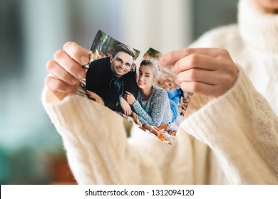 Woman Tearing Up Photo Of Happy Couple, Closeup. Concept Of Divorce