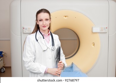 Woman Technologist With CT Scan Machine