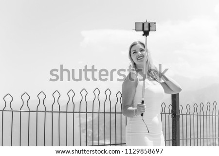 Woman with telephone take a selfie on vacation and enjoy the moment 