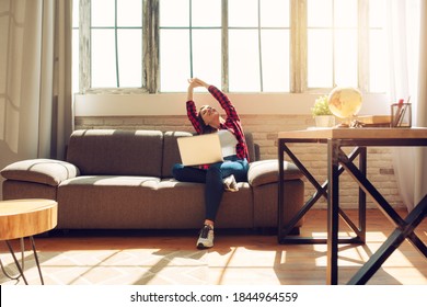 Woman teleworker works at home with a laptop. She is in smart working due to covid-19 pandemic - Shutterstock ID 1844964559