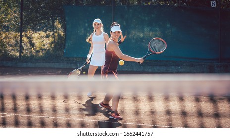 Woman in a tennis double on a sunny day