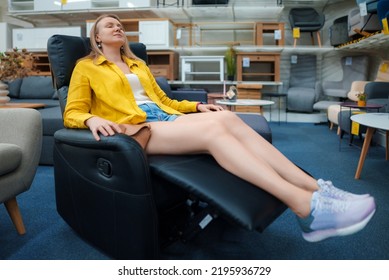 Woman Testing Massage Folding Chair In A Store.