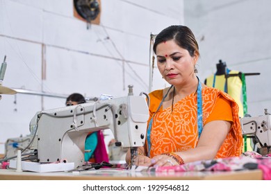 Woman Textile Worker Using Sewing Machine On Production Line