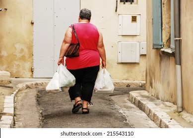 A Woman That's Going Home With Her Groceries