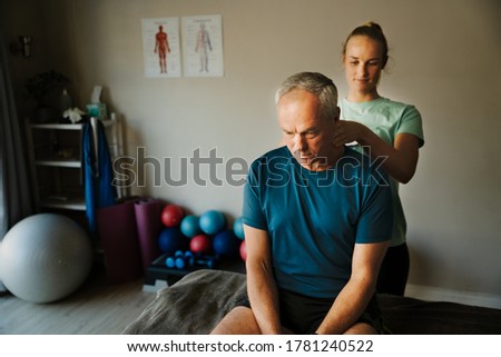 Similar – Image, Stock Photo Content female physiotherapist treating neck of patient