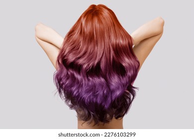 woman with thick wavy hair and a variety of shades of color palette. Coloring in different colors. Ombre