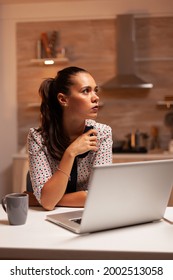 Woman Thinking About Her Career While Working On A Deadline Late At Night In Home Kitchen. Employee Using Modern Technology At Midnight Doing Overtime For Job, Business, Busy, Career, Network