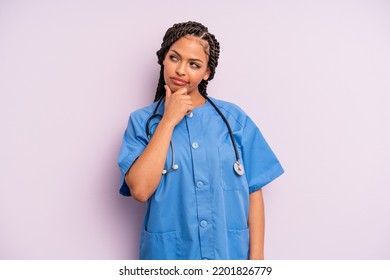  Woman Thinking, Feeling Doubtful And Confused. Nurse Concept