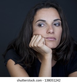 woman thinking on black background - Shutterstock ID 138051242