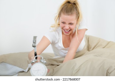 Woman Threatening Alarm Clock With A Hammer