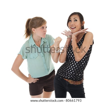 woman threatening her friend who is playing the innocent, isolated on white background