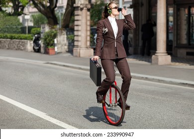 Woman Through The City With The Unicycle To Go To Work, Outdoor