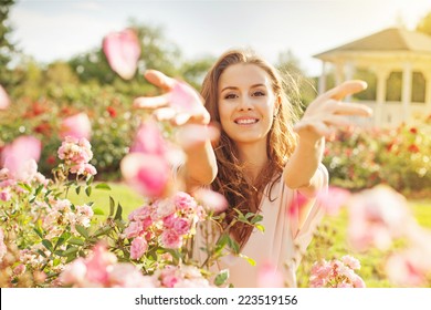 woman throwing rose petals