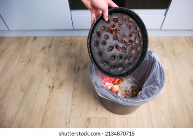 A Woman Throws A Burnt Pie In The Trash.