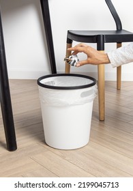 Woman Throws Garbage Into A Bucket. White Plastic Bucket With Bag. Cleanliness In The House. Trash Can For Kitchen, Living Room, Bathroom Or Hallway