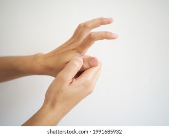 Woman With Thumb Pain On White Background Health And Physical Concept.