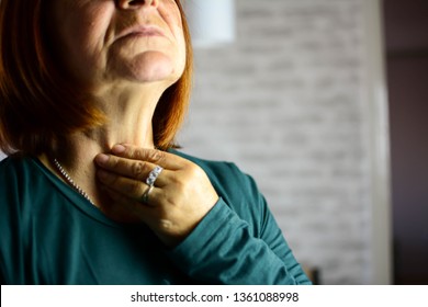 Woman Thyroid Gland Control. Senior Lady Sweeping The Laryngeal, Laryngitis, Goiter Or Hypothyroidism. Disorder Of The Endocrine System. Hashimoto’s Thyroiditis, Lymphocytic Thyroiditis.