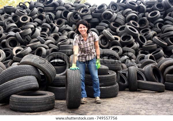 woman in a tire recycling\
plant