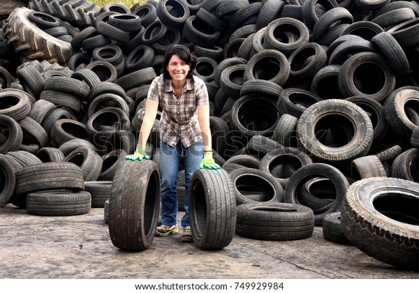 woman in a tire recycling\
plant