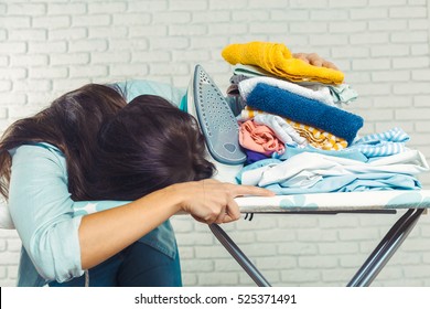 Woman Tired Ironed Clothes And Lay Down On The Ironing Board