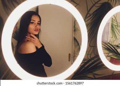 The Woman In The Toilet With Mirror. Bathroom Of A Restaurant.