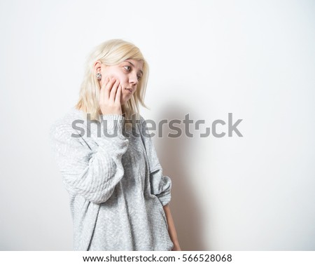 Similar – Young blonde woman with a headache