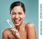 Woman, toothbrush and wink on studio background for portrait, dental care and gum health. Girl, brush or toothpaste for oral hygiene with positive attitude, plaque removal or healthy mouth protection