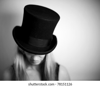 Woman In Top Hat Looking Down