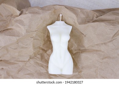 Woman Torso Hand Made Candle On Craft Brown Paper.