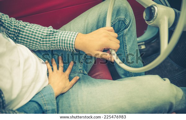 woman\
touch his boyfriend. concept about sex in the\
car