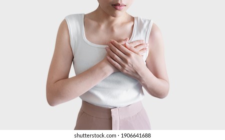 Woman Touching Chest. Heart Attack, Heart Disease, And Chest Pain Concepts, On White Background