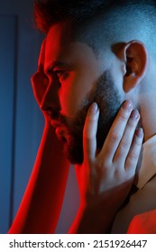 Woman Touching Handsome Bearded Man's Face On Light Background. Color Toned