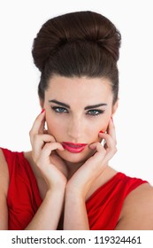 Woman Touching Her Face And Looking Serious While Having Beehive Hairstyle