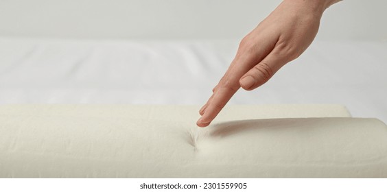 Woman touching memory foam pillow, closeup. Banner design with space for text - Shutterstock ID 2301559905