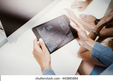 Woman Touching Screen Electronic Tablet Hand.Project Managers Researching Process.Business Team Working New Startup Modern Office.HiTech Virtual Digital Charts Interfaces.Analyze Market Stock.Blurred