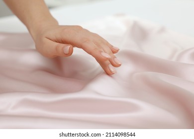 Woman touching smooth silky fabric, closeup view - Shutterstock ID 2114098544