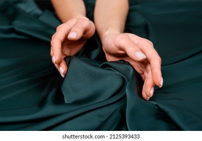 Woman Touching Soft Dark Green Fabric, Closeup